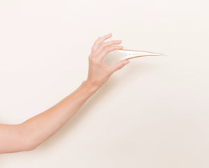 Golden Blonde TopBun hair clip shown in a hand for size perspective